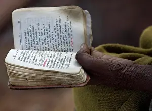 Ethiopia Prints: Close-up of a person's hand holding the Bible