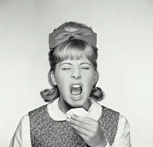Eyes Prints: Close-up of a teenage girl sneezing