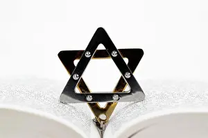 Hebrew Prints: Close-up detail of a Torah in hebrew and a star of David. Jewish symbols