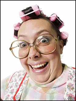 To Camera Prints: Close-up of woman in curlers with glasses