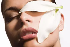 Maintenance Prints: close-up of woman face with flower patals