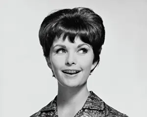 Looking Sideways Prints: Close-up of a young woman smiling