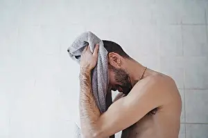 Upper Body Prints: close up white man drying himself at home in his bathroom