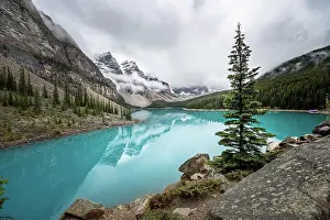 Unesco World Natural Heritage Prints: Clouds hanging between mountain peaks