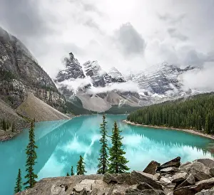 Unesco World Natural Heritage Prints: Cloudy mountain peaks, reflection in turquoise glacial lake