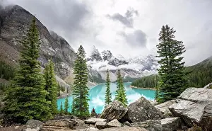 Unesco World Natural Heritage Prints: Cloudy mountain peaks, turquoise glacial lake