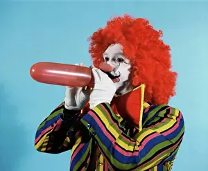 Circus Prints: Clown blowing up balloon