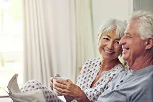 Newspaper Prints: Coffee, newspaper and a senior couple in bed