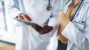 Doctors Prints: Collaboration, hands and tablet with doctors in hospital together for medical consulting