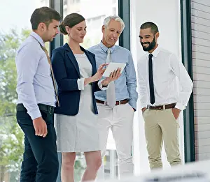 Collaboration, tablet and meeting with business people in office together for discussion or planning