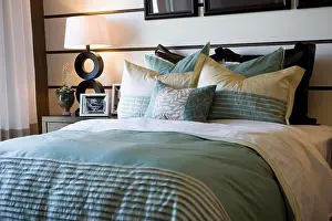 Architectural Prints: Collection of pillows on bed