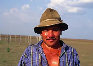 Colombia, Casanare, Llanero Cowboy Wearing A Hat And Standing In A Field