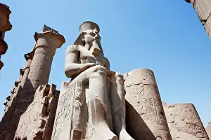 Courtyard Prints: Colossal Statue Of Statue Of Ramses Ii And Queen Nefertari In The Courtyard Of Ramses Ii The Luxor Temple