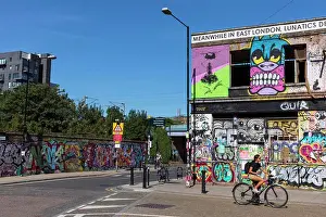 Capital Cities Prints: Colourful graffiti covers the now derelict corner pub The Lord Napier in Hackney Wick