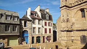 Historic District Prints: Colourful houses with traditional facades next to a historic building, Morlaix, France