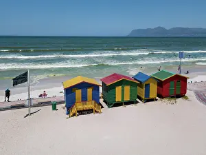 Tourismus Prints: Colourful wooden beach huts at Muizenberg beach Colourful wooden beach huts with solar panel