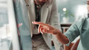 Computer, pointing or hands of business people with teamwork for info