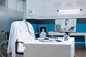 Examination Prints: Computer with remote doctor having online telework videocall