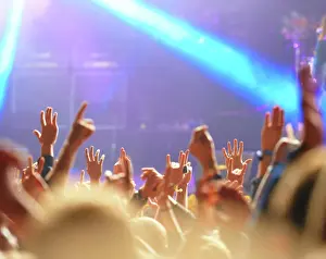 Live Prints: Concert, audience and hands in crowd with light for music festival