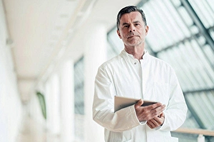 Competence Prints: Confident scientist with tablet PC at office