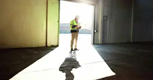 Builder Prints: Construction site, empty warehouse and man on tablet for inspection