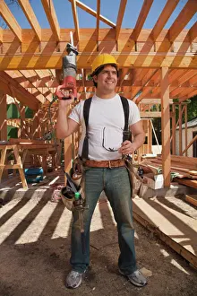Verticals Prints: Construction worker wearing a hard hat