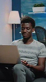 Browsing Prints: Corporate employee doing online remote work on laptop