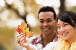 Husband Prints: Couple admiring autumn leaves outdoors