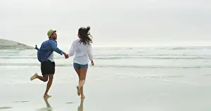 Playful Prints: Couple, beach and running on sand or holding hands on honeymoon