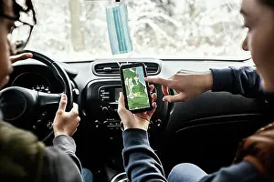 Visitor Prints: Couple consulting gps while traveling