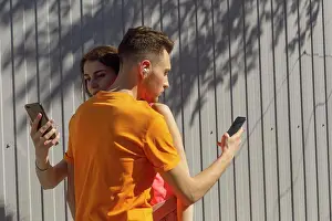 Texting Prints: Couple hugging and using smart phones