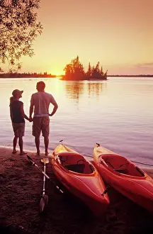 Paddle Prints: Couple with kayaks at Otter Falls campground, Whiteshell Provincial Park, Manitoba, Canada