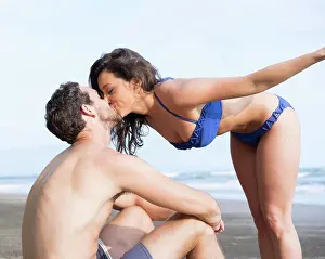 Bikini Prints: Couple kissing on beach