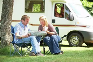 Caravan Prints: Couple Relaxing Outside Motor Home On Vacation