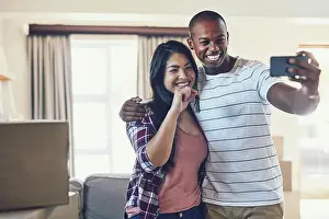 Logistics Prints: Couple, selfie and keys in new home for moving