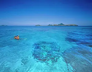 Pure Prints: Couple snorkelling in tropical water in the Fiji Islands