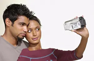 Sseditor Aa Prints: Couple using video camera