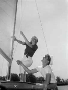 Adjusting Prints: Couple on yacht deck adjusting sail