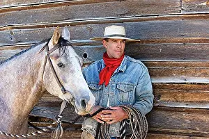 Cowboy Hats Prints: Cowboy with horse at barn, wildwest, Oregon, USA, North America