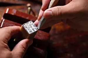 Knife Prints: Craftsman carving Chinese character into a Chinese chop
