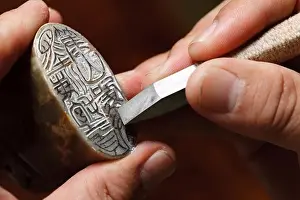 Knife Prints: Craftsman carving Chinese character into a Chinese chop