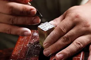 Knife Prints: Craftsman carving Chinese character into a Chinese chop