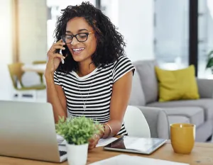 Call Prints: Creative designer, laptop and phone call with remote work for startup