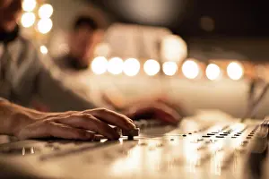 Talent Prints: Cropped sound director recording music