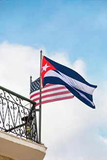 Cuba, Havana, Old Havana. Cuban and American flags flying simultaneously