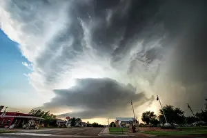 Shannon Prints: Cumulonimbus cloud forming over a small town on Texas USA