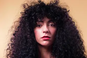 Gorgeous Prints: Curly woman in studio