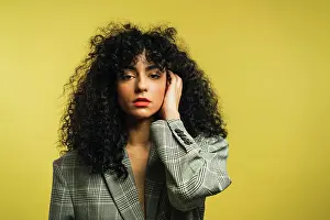 Attractive Prints: Curly woman in studio