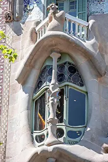 Multicoloured Prints: Curved colourful window, artistic facade of Casa Batllo by Antoni Gaudi
