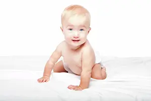 Niedlich Prints: Cute crawling baby Cute adorable happy crawling baby infant with blue eyes in diapers